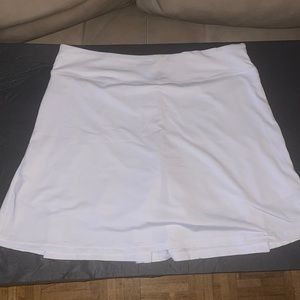 Coorun Womens Tennis Pleated Skirt with shorts and pockets.